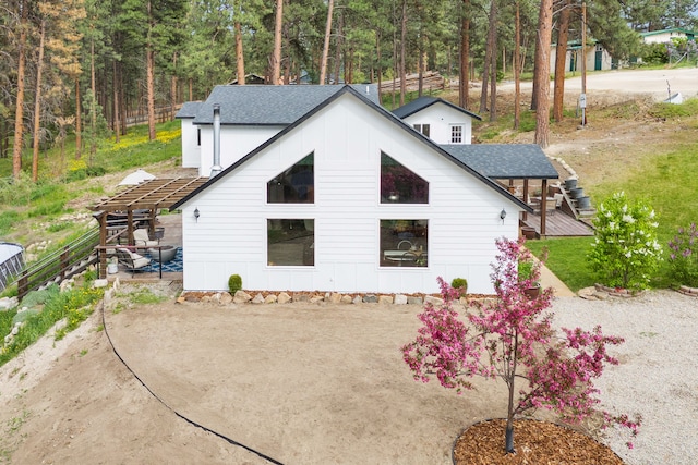 440 E 20th St, Hamilton, MT 59840 - view of home's exterior featuring board and batten siding and a shingled roof