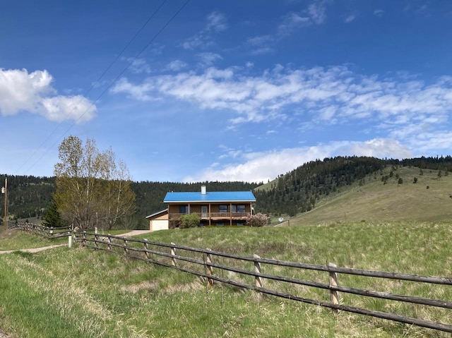 42984 Flathead View Dr, Polson, MT 59860 - view of yard featuring a view of countryside and a wooden deck