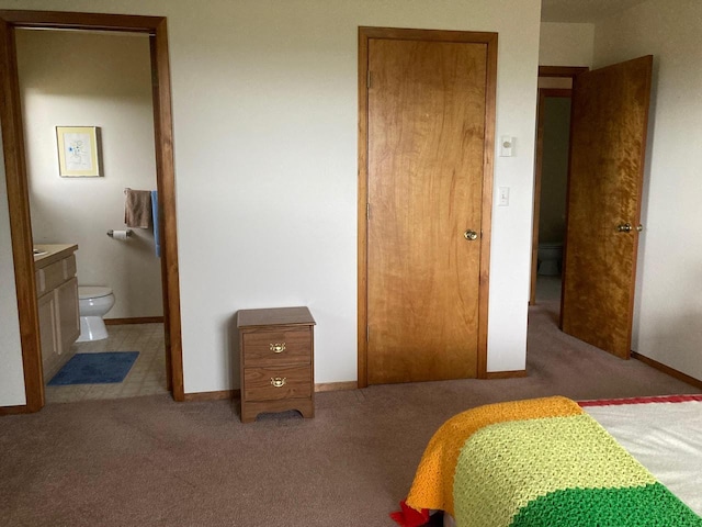 42984 Flathead View Dr, Polson, MT 59860 - bedroom with carpet floors, baseboards, and ensuite bath