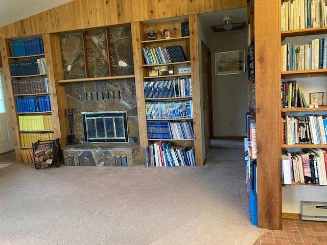 42984 Flathead View Dr, Polson, MT 59860 - sitting room featuring a stone fireplace, wood walls, and carpet flooring