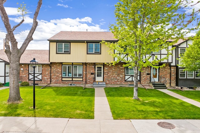 1200 32nd St S Unit 6, Great Falls, MT 59405 - view of front of property with a front lawn, roof with shingles, and brick siding