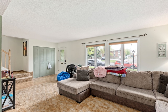 1200 32nd St S Unit 6, Great Falls, MT 59405 - living area featuring a textured ceiling, stairway, and light wood finished floors