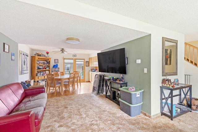 1200 32nd St S Unit 6, Great Falls, MT 59405 - carpeted living room featuring a textured ceiling, a ceiling fan, and stairway