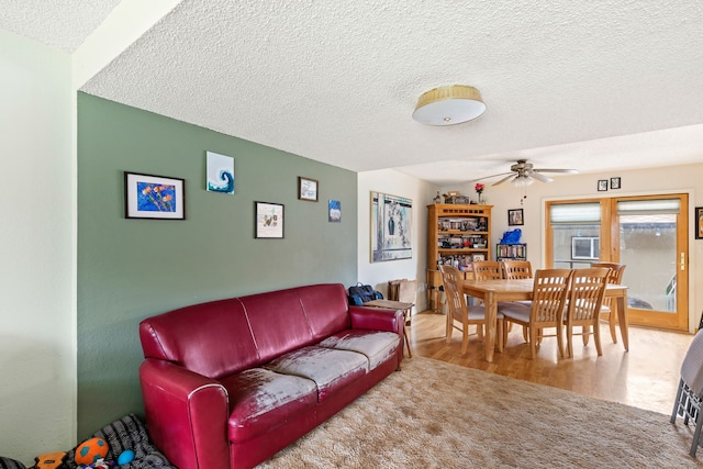 1200 32nd St S Unit 6, Great Falls, MT 59405 - living area with a textured ceiling, a ceiling fan, and wood finished floors
