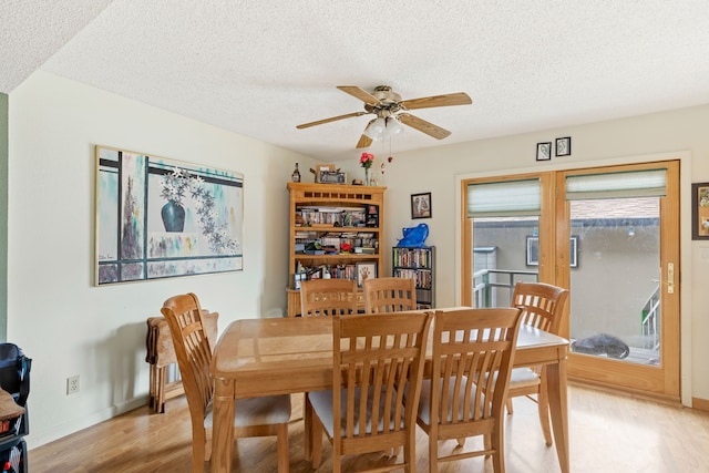 1200 32nd St S Unit 6, Great Falls, MT 59405 - dining area featuring light wood-type flooring, a ceiling fan, a textured ceiling, and baseboards