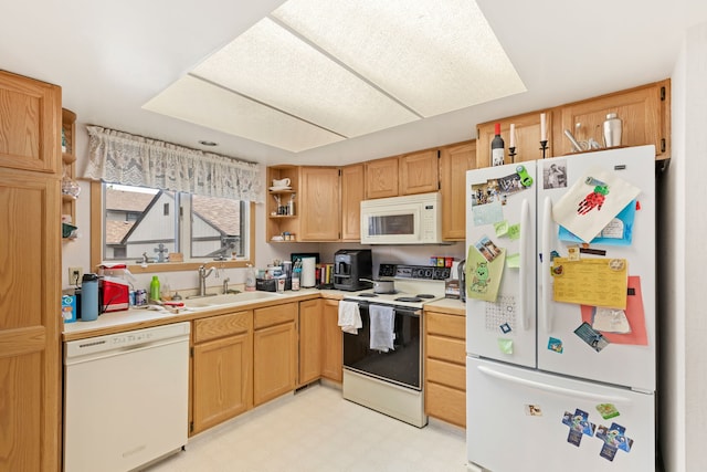 1200 32nd St S Unit 6, Great Falls, MT 59405 - kitchen with white appliances, a sink, light countertops, open shelves, and light flooring