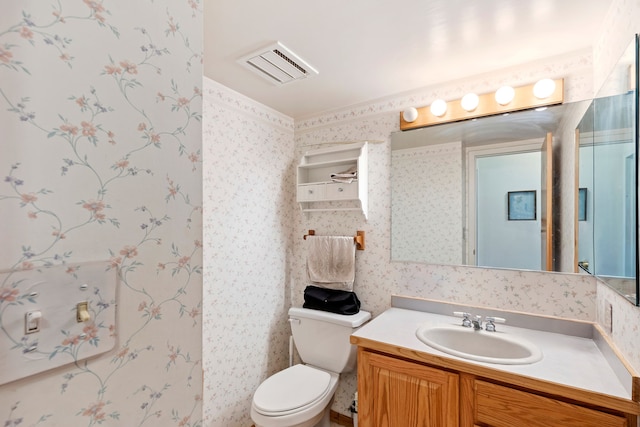 1200 32nd St S Unit 6, Great Falls, MT 59405 - bathroom with wallpapered walls, toilet, and vanity