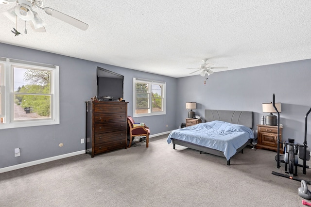 1200 32nd St S Unit 6, Great Falls, MT 59405 - carpeted bedroom featuring a textured ceiling, a ceiling fan, and baseboards
