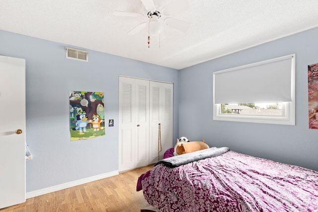 1200 32nd St S Unit 6, Great Falls, MT 59405 - bedroom featuring wood finished floors, a closet, baseboards, and a ceiling fan