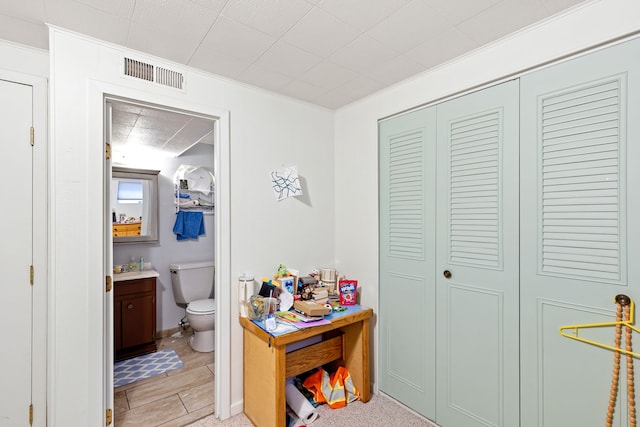 1200 32nd St S Unit 6, Great Falls, MT 59405 - bathroom featuring toilet, vanity, crown molding, and a closet