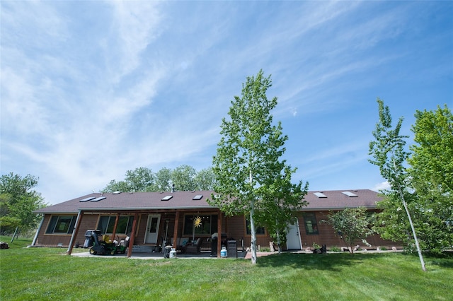 117 Woodland Estates Rd, Great Falls, MT 59404 - back of house featuring a patio area and a yard