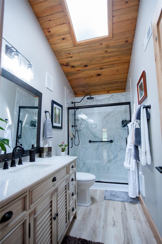 117 Woodland Estates Rd, Great Falls, MT 59404 - full bath featuring wood ceiling, lofted ceiling, a marble finish shower, vanity, and toilet