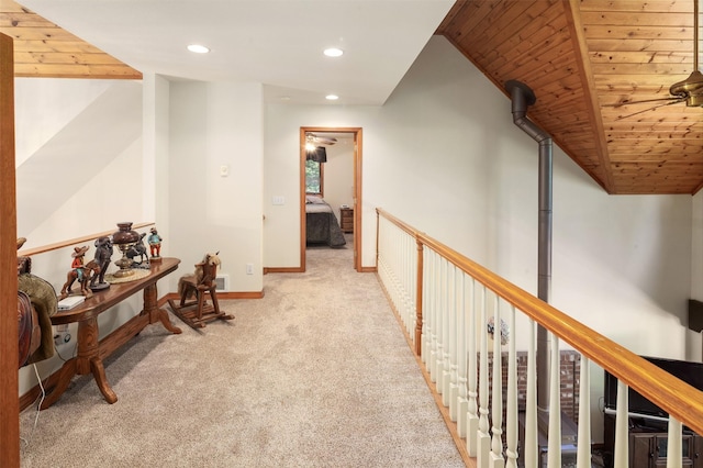 corridor with carpet, recessed lighting, wooden ceiling, and baseboards