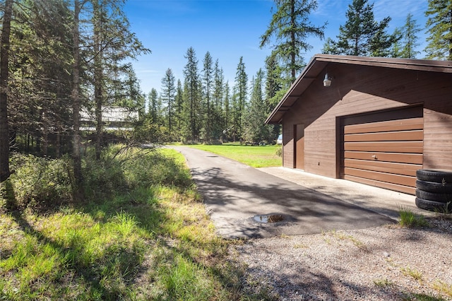 detached garage featuring driveway