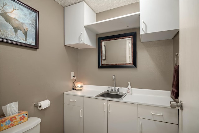 half bath featuring toilet and vanity