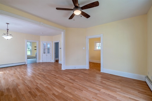 unfurnished living room with a ceiling fan, light wood-style flooring, baseboard heating, and baseboards