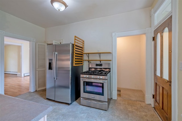 kitchen featuring stainless steel appliances and a baseboard heating unit