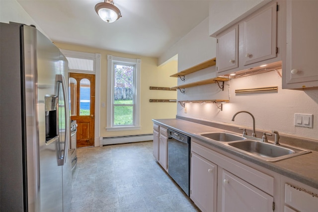 kitchen with stainless steel fridge, black dishwasher, a baseboard heating unit, a sink, and open shelves