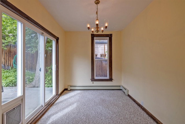 unfurnished room featuring carpet floors, a chandelier, baseboards, and baseboard heating
