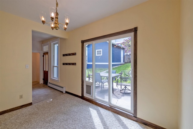 carpeted spare room featuring baseboard heating, a chandelier, plenty of natural light, and baseboards