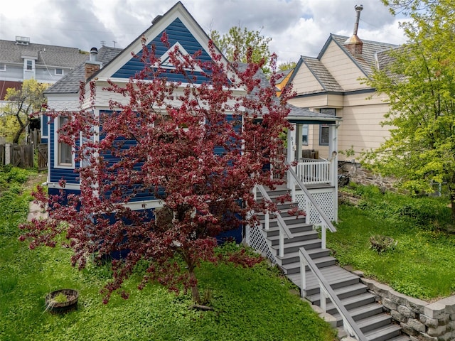 view of front of house with stairs