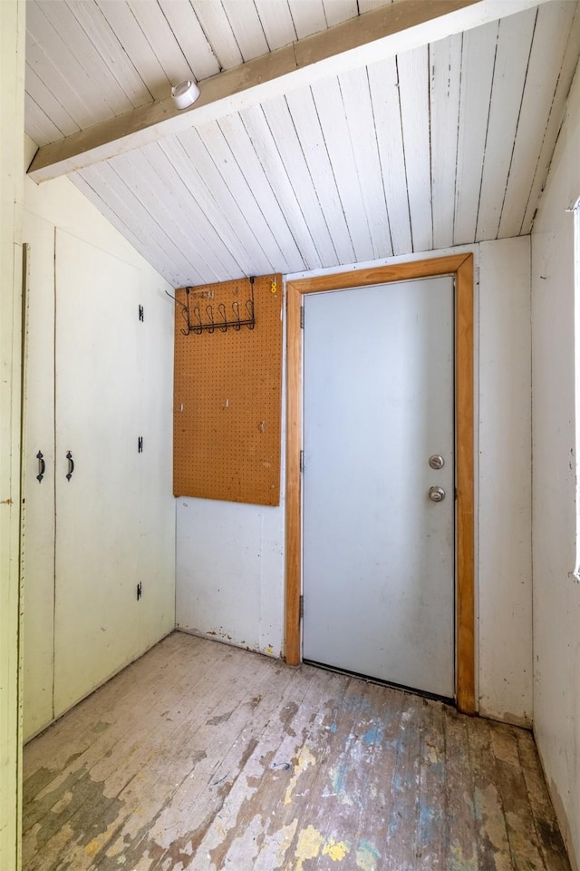 unfurnished room with wood ceiling and hardwood / wood-style flooring