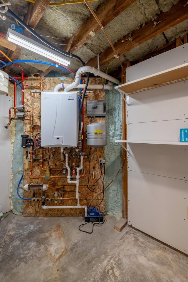 utility room featuring tankless water heater