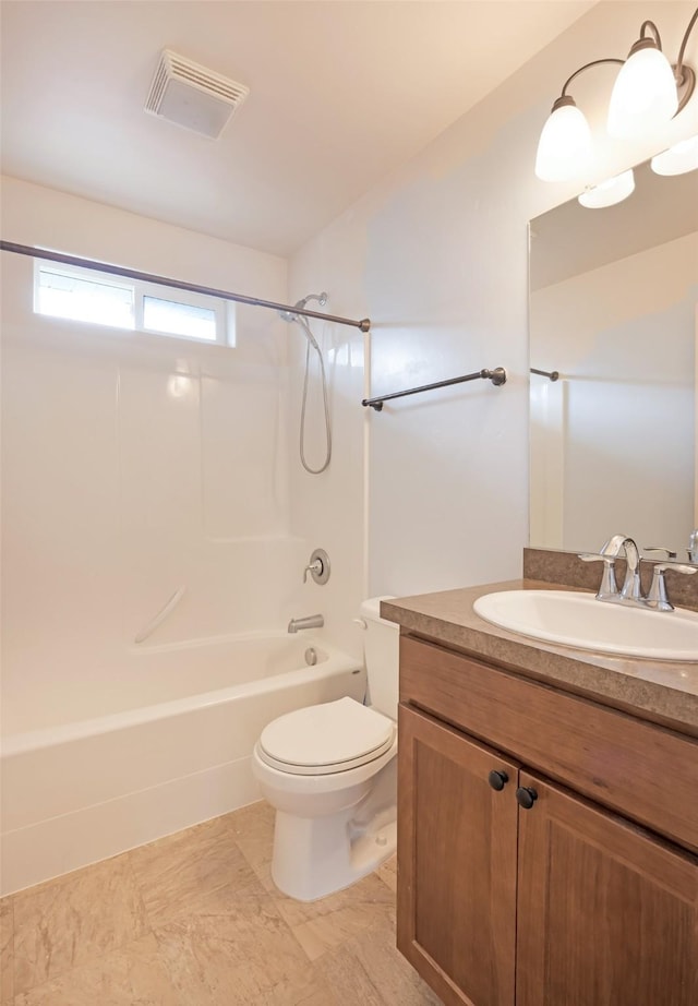 bathroom with toilet, shower / bath combination, and vanity