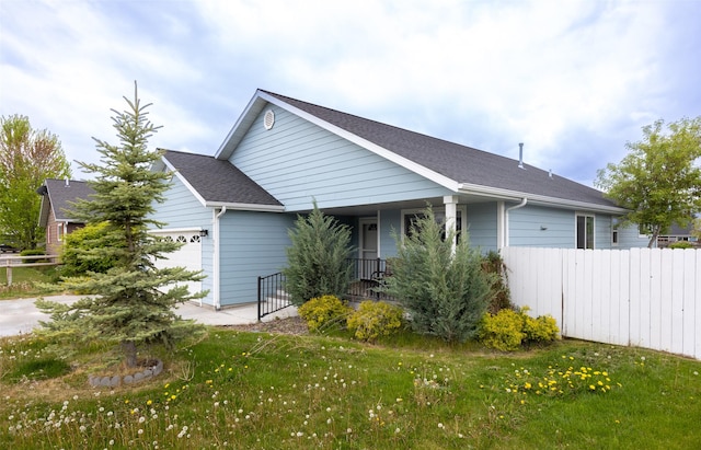 view of home's exterior featuring a garage, a porch, and a shingled roof