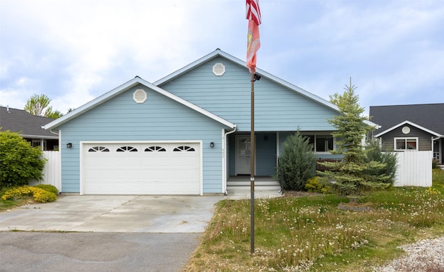 view of front of home featuring a garage, concrete driveway, a porch, and fence