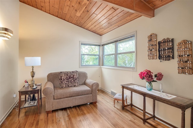 sitting room featuring wood ceiling, light wood-type flooring, and baseboards