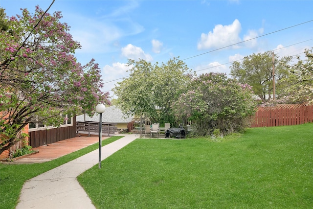 view of yard featuring a wooden deck