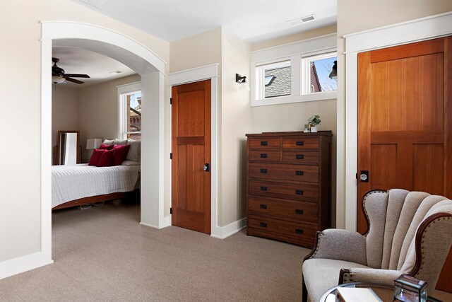 432 W Spruce St Unit 202, Missoula, MT 59802 - sitting room featuring carpet floors, a ceiling fan, arched walkways, and baseboards