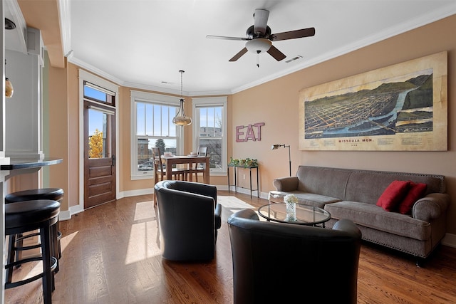 432 W Spruce St Unit 202, Missoula, MT 59802 - living area featuring ornamental molding, dark wood-type flooring, baseboards, and ceiling fan