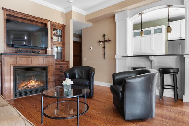 432 W Spruce St Unit 202, Missoula, MT 59802 - living room with baseboards, ornamental molding, wood finished floors, and a glass covered fireplace