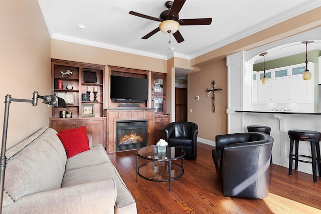432 W Spruce St Unit 202, Missoula, MT 59802 - living area with a ceiling fan, wood finished floors, a glass covered fireplace, ornamental molding, and baseboards