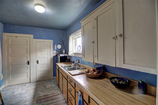 110 N 2nd Ave, Hot Springs, MT 59845 - kitchen with a sink and baseboards