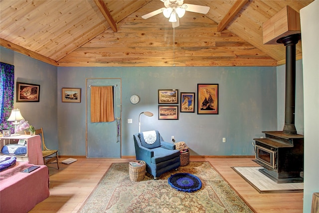 110 N 2nd Ave, Hot Springs, MT 59845 - living area featuring wood finished floors, wood ceiling with exposed beams, a wood stove, a ceiling fan, and high vaulted ceiling