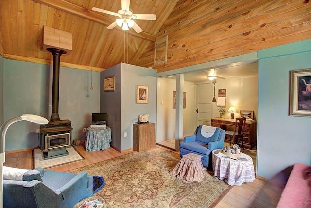 110 N 2nd Ave, Hot Springs, MT 59845 - living room featuring a wood stove, wood finished floors, wood ceiling with exposed beams, ceiling fan, and high vaulted ceiling