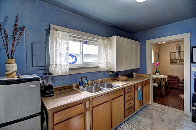 110 N 2nd Ave, Hot Springs, MT 59845 - kitchen with a sink, freestanding refrigerator, and electric panel