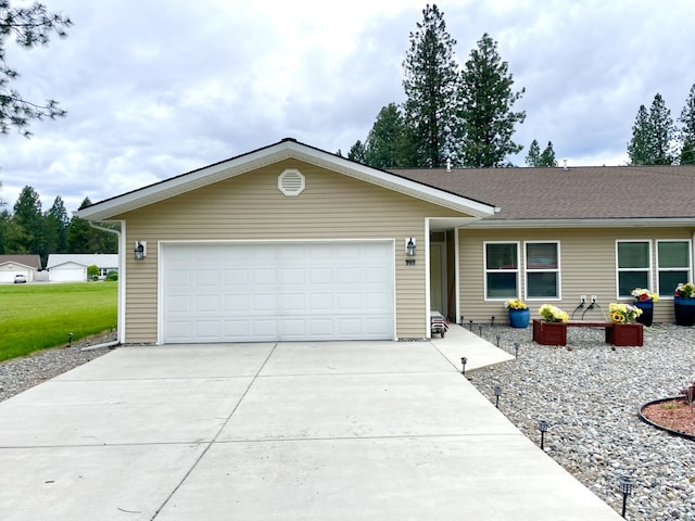 998 Mount Silcox Dr, Thompson Falls, MT 59873 - single story home featuring concrete driveway and an attached garage
