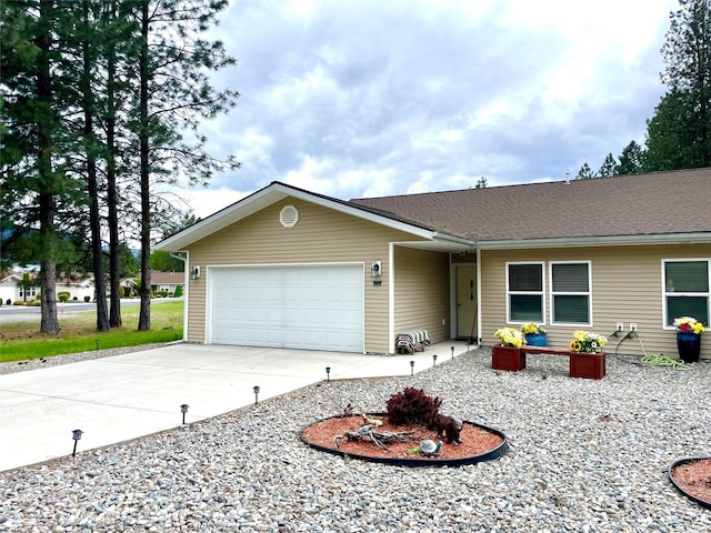 998 Mount Silcox Dr, Thompson Falls, MT 59873 - ranch-style house featuring a garage and driveway