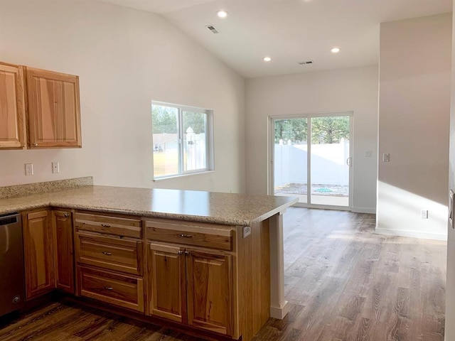 998 Mount Silcox Dr, Thompson Falls, MT 59873 - kitchen featuring stainless steel dishwasher, light countertops, a peninsula, wood finished floors, and recessed lighting