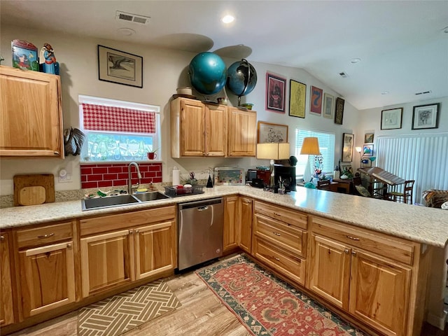 998 Mount Silcox Dr, Thompson Falls, MT 59873 - kitchen with dishwasher, a peninsula, light wood-style floors, lofted ceiling, and light countertops