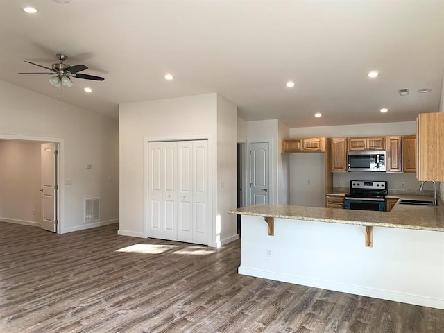 998 Mount Silcox Dr, Thompson Falls, MT 59873 - kitchen featuring stainless steel microwave, electric range oven, wood finished floors, recessed lighting, and a ceiling fan