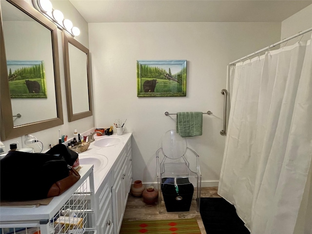 998 Mount Silcox Dr, Thompson Falls, MT 59873 - bathroom with double vanity, wood finished floors, and a shower with curtain
