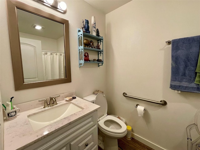 998 Mount Silcox Dr, Thompson Falls, MT 59873 - full bath with vanity, toilet, and wood finished floors