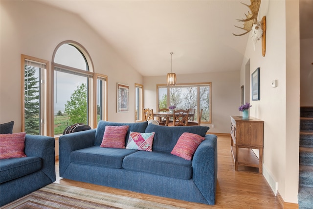 5190 Goodan Ln, Missoula, MT 59808 - living area with light wood-style floors and high vaulted ceiling