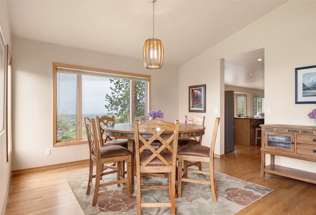 5190 Goodan Ln, Missoula, MT 59808 - dining room featuring healthy amount of natural light, light wood finished floors, vaulted ceiling, baseboards, and recessed lighting
