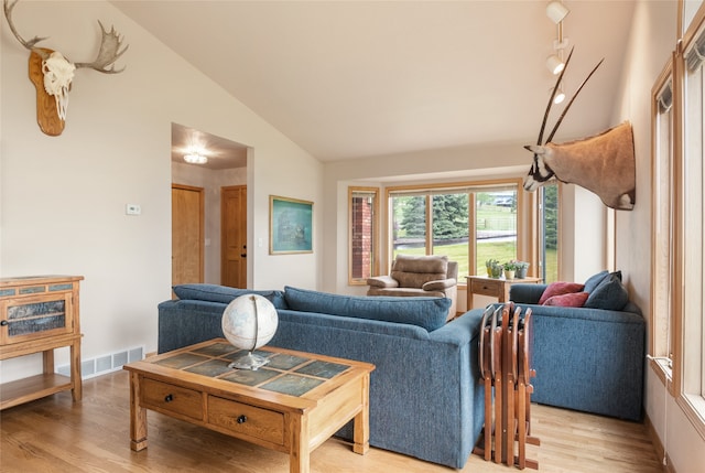 5190 Goodan Ln, Missoula, MT 59808 - living room with light wood-style floors and high vaulted ceiling